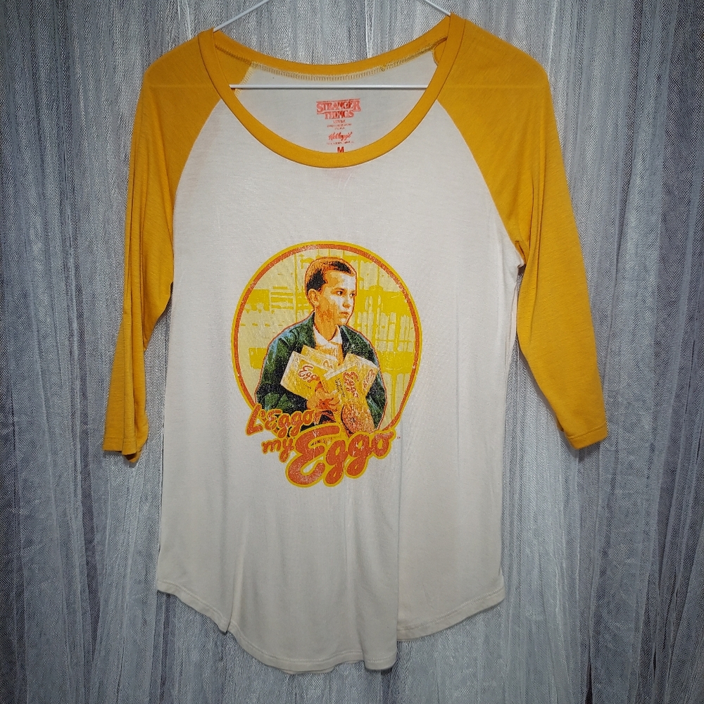 STRANGER THINGS EGGO YELLOW 3/4 SLEEVE SOFT MATERIAL SIZE MEDIM